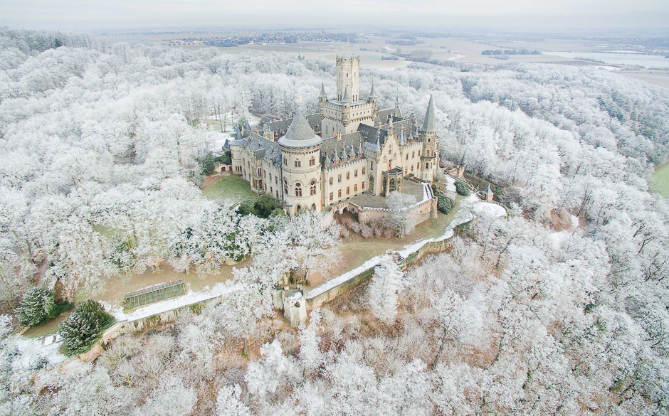 Aerial view taken with a drone shows the Marienburg Castle near Pattensen, northern Germany, standing amidst a snow-covered forest. PHOTO: AFP