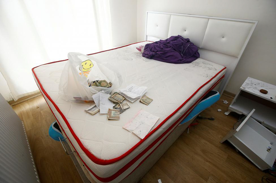 Foreign currency banknotes and various documents are seen in the bedroom of a hideout where the alleged attacker of Reina nightclub was caught by Turkish police last night, in Esenyurt neighbourhood in Istanbul, Turkey. PHOTO: REUTERS