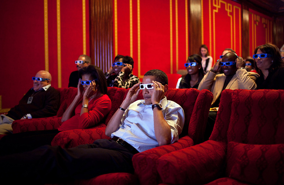 During a Super Bowl watching party in the White House theatre, the President and First Lady join their guests in watching one of the TV commercials in 3D. PHOTO: PETE SOUZA