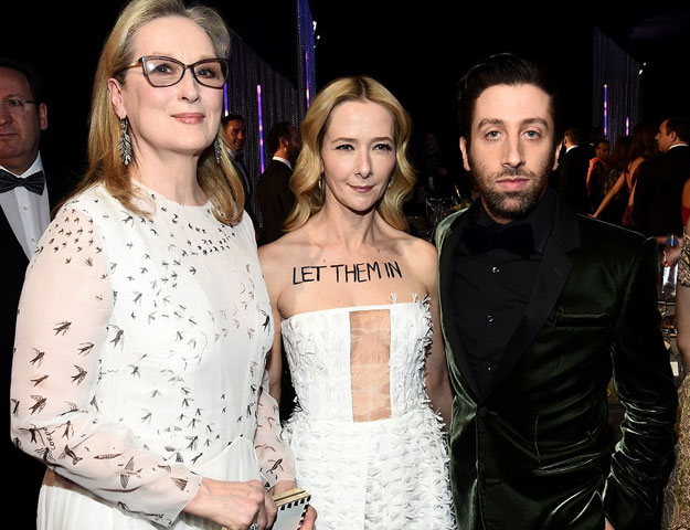 Actress Meryl Streep, who delivered harsh criticism of President Donald Trump and his policies during her speech at the Golden Globes, posed for a photo with Towne and Helberg who made their opinions really clear about the ban. PHOTO: DAILY MAIL
