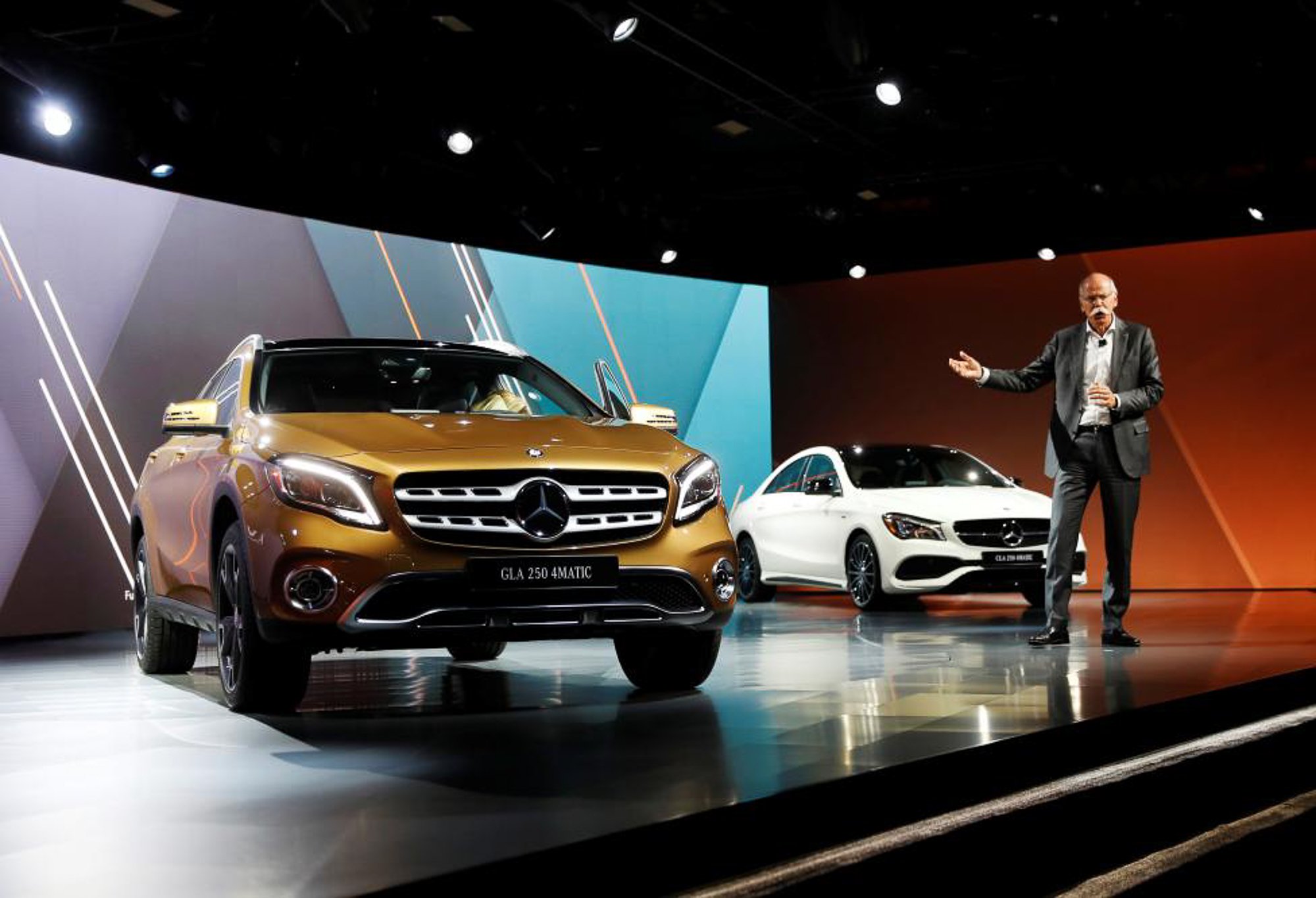 Chairman of the Board of Directors of Daimler AG Dieter Zetsche speaks in front of the revealed Mercedes-Benz GLA 250. PHOTO: REUTERS 