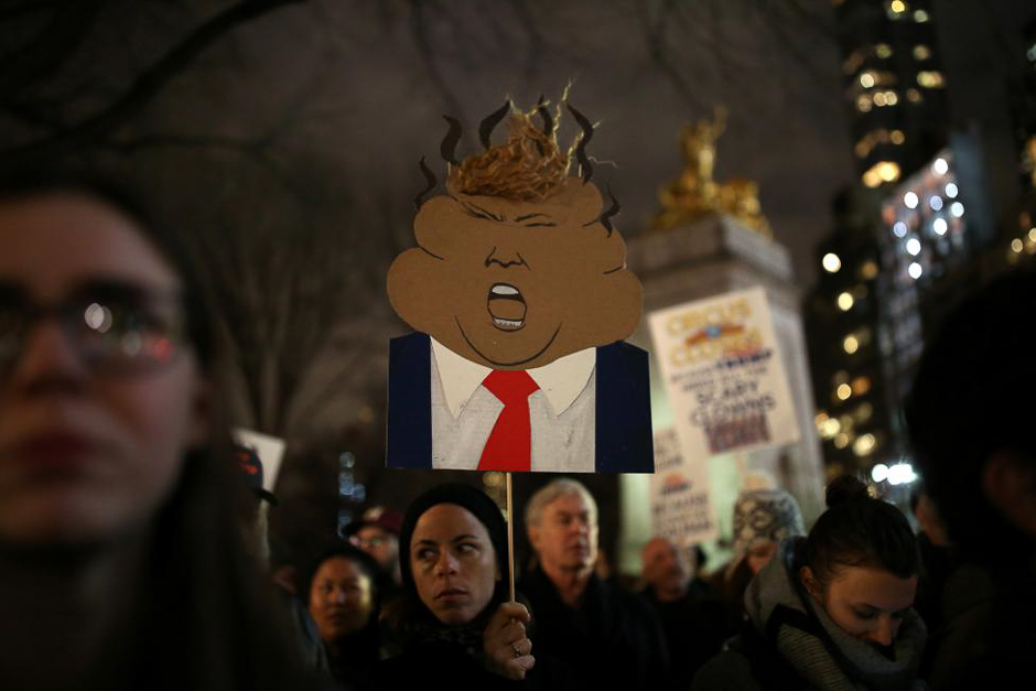 People rally against President-elect Donald Trump outside Trump International Hotel and Tower at Columbus Circle in Manhattan, New York City.