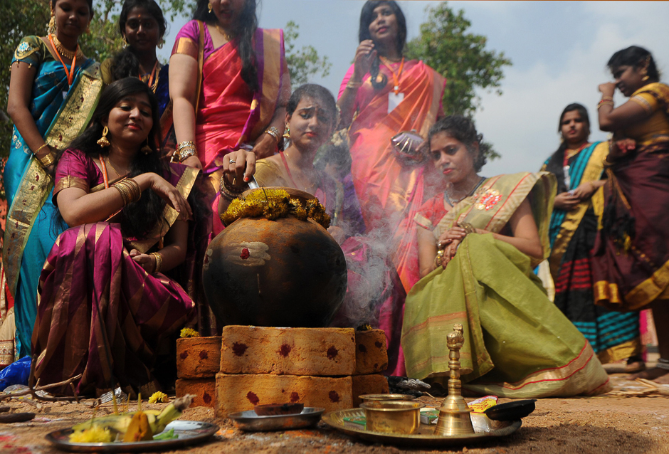 Indian women prepare pongal during celebrations of the Tamil harvest festival, Pongal at a college in Chennai. PHOTO: AFP