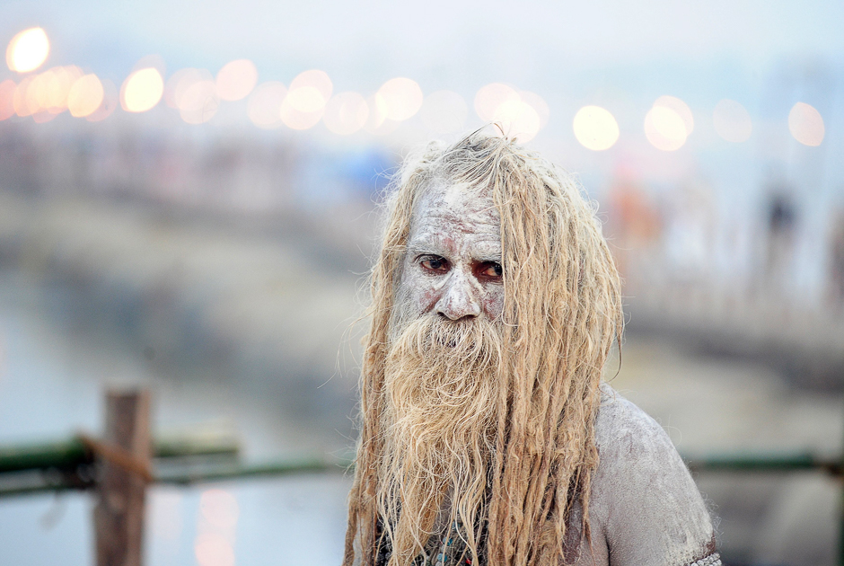 An Indian Sadhu (Hindu holy man) looks on after bathing in the River Ganges and smearing his body with ash, during the Magh Mela festival in Allahabad. PHOTO: AFP