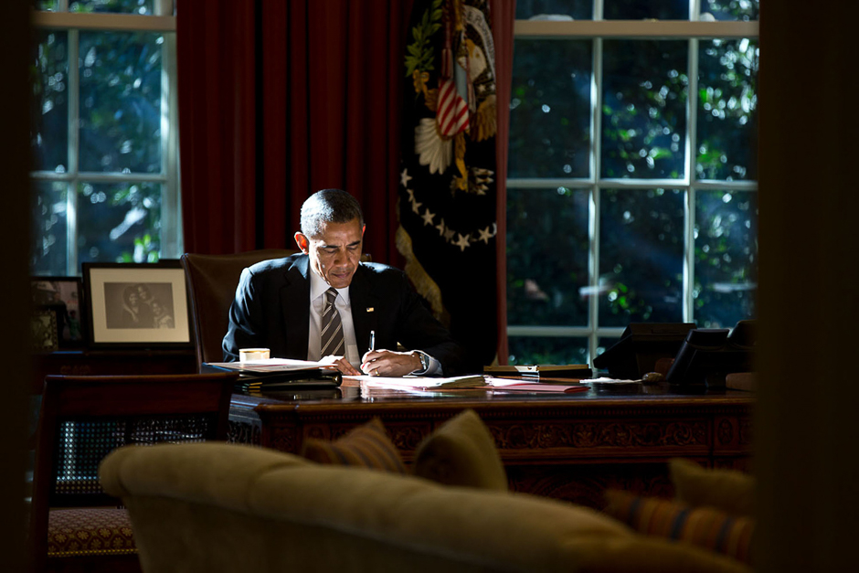 The President works at the Resolute Desk in the Oval Office. PHOTO: PETE SOUZA