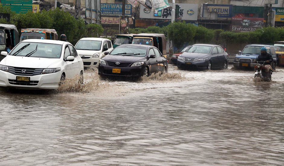 Rain water is seem accumulated on Abdullah Haroon Road. PHOTO: ONLINE/SABIR MAZHAR