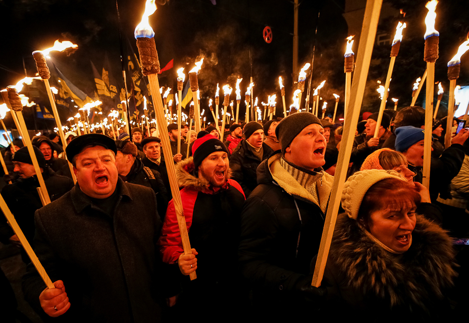 Activists and supporters of the Svoboda (Freedom), Ukrainian nationalist party, take part in a march with torches to honour several hundred students who died during a battle while defending the Ukrainian capital from the Bolsheviks, in Kiev, Ukraine. PHOTO: REUTERS