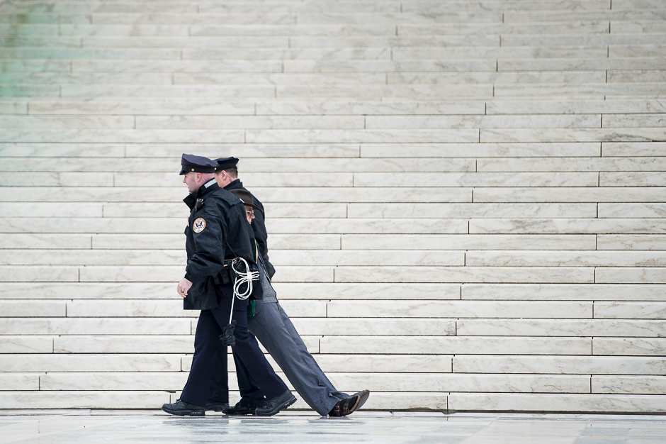Police officers remove activists during an anti death penalty protest at the US Supreme Court in Washington, DC. PHOTO: AFP