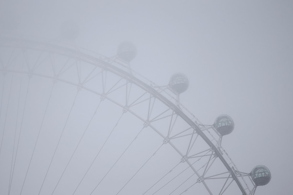 The London Eye appears through thick fog, London, England. PHOTO: AFP