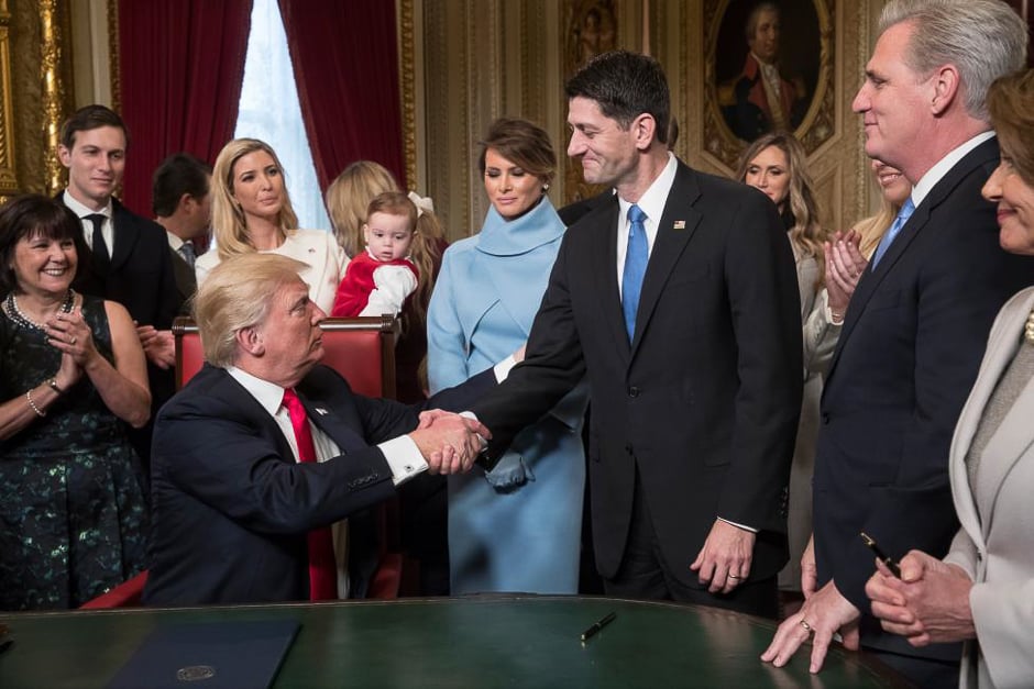 President Trump shakes hands with House Speaker Paul Ryan as he is joined by the Congressional leadership and his family while he formally signs his cabinet nominations into law, in the President's Room of the Senate, at the Capitol, following his swearing-in. PHOTO: REUTERS