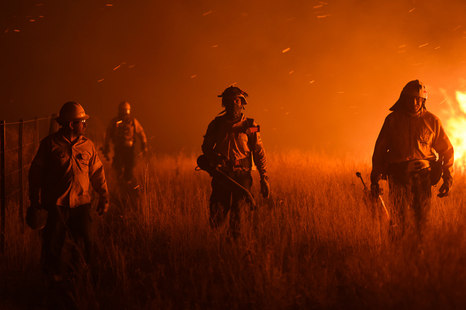 Firemen fight a wildfire near La Adela in La Pampa Province. PHOTO: AFP