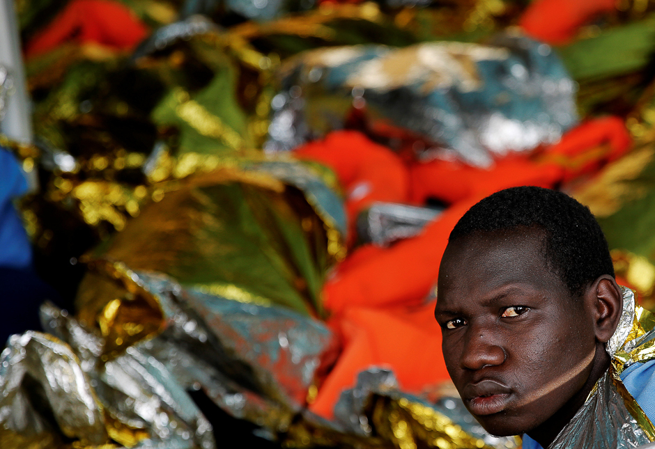 A migrant looks on, onboard the former fishing trawler Golfo Azzurro after the Spanish NGO Proactiva Open Arms, as the raft he was on drifted out of control in the central Mediterranean Sea, some 36 nautical miles off the Libyan coast. PHOTO: REUTERS