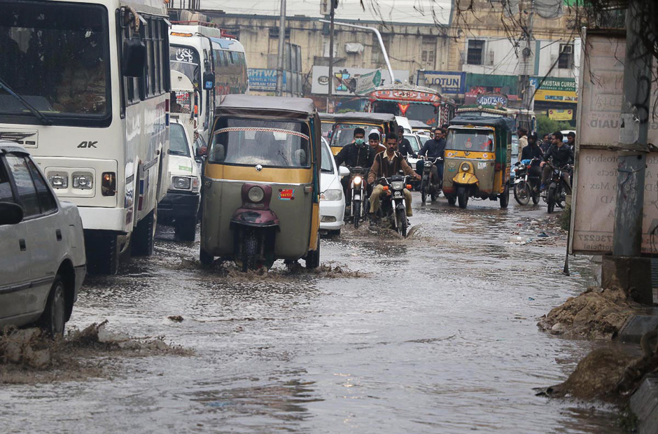 Rain water is seen accumulated on road in the area of Guru Mandir. PHOTO: ONLINE/SABIR MAZHAR