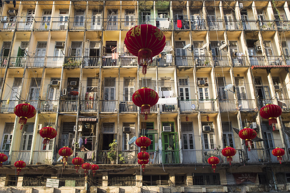 Decorative lanterns are seen hung past residential flats ahead of the Chinese Lunar New Year in Yangon's Chinatown district. PHOTO: AFP