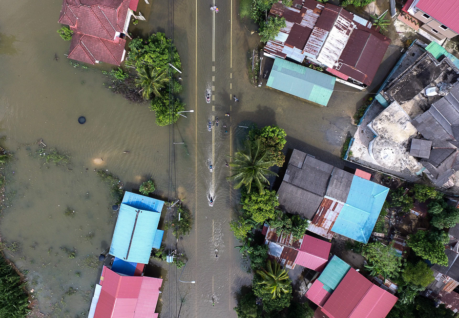 An aerial view shows the flooded area in Jal Besar, Malaysia's northeastern town of Tumpat, which borders Thailand. PHOTO: AFP