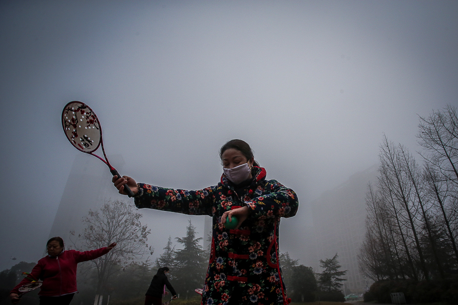 People exercise among heavy smog in Hefei, Anhui province, China. PHOTO: REUTERS