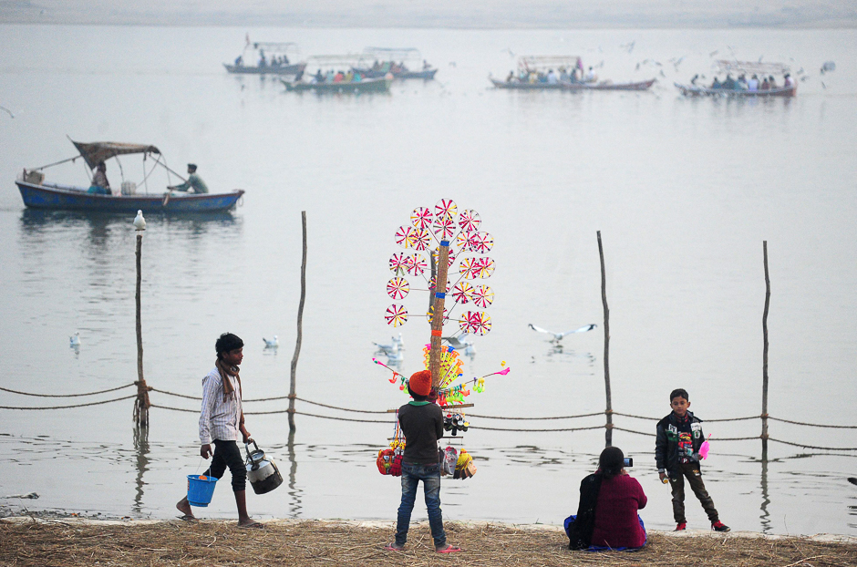 An Indian youth sells hand-made toys at Sangam during the Magh Mela festival in Allahabad. PHOTO: AFP