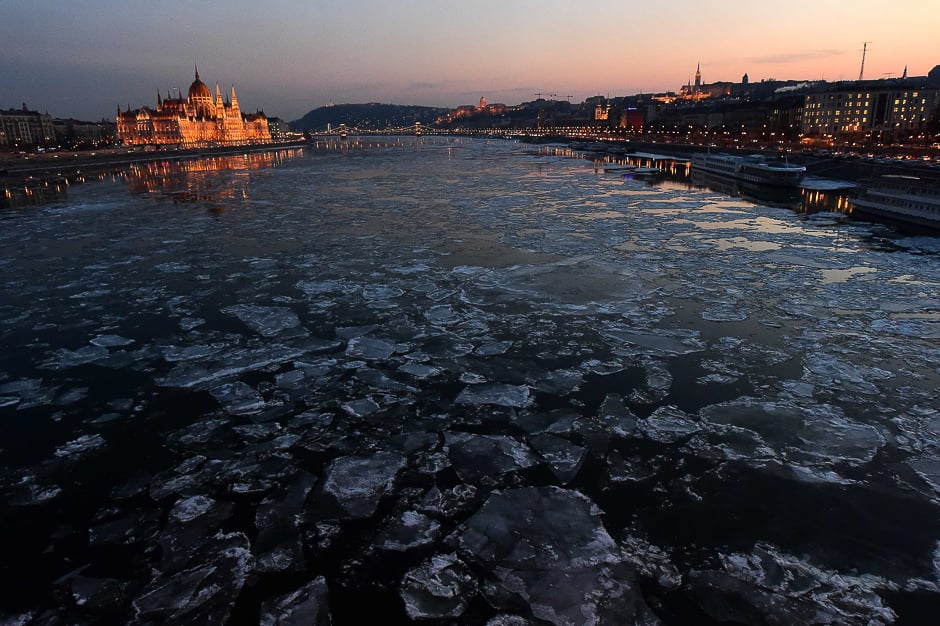 Ice floes float in the water of the River Danube nearby the parliament building (L) of Budapest. PHOTO: AFP