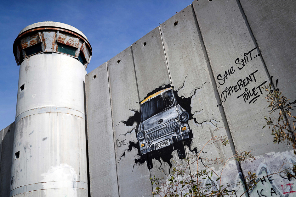 10.are seen on the Israel's controversial separation barrier between the West Bank city of Bethlehem and Jerusalem. PHOTO: AFP