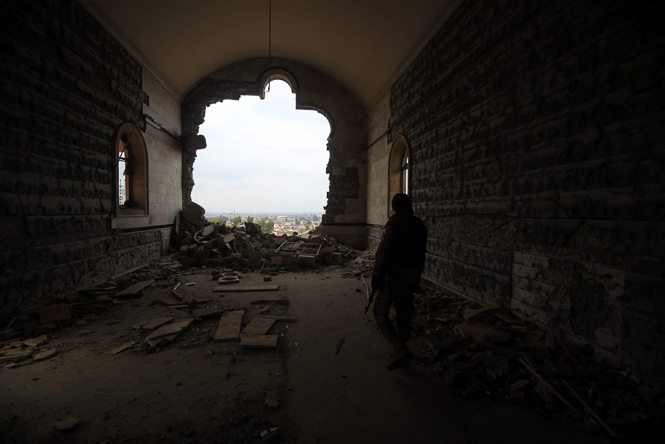 An Iraqi soldier inspects the debris at St. George's Monastery (Mar Gurguis), a historical Chaldean Catholic church on the northern outskirt of Mosul, which was destroyed by Islamic State (IS) group in 2015. PHOTO: AFP