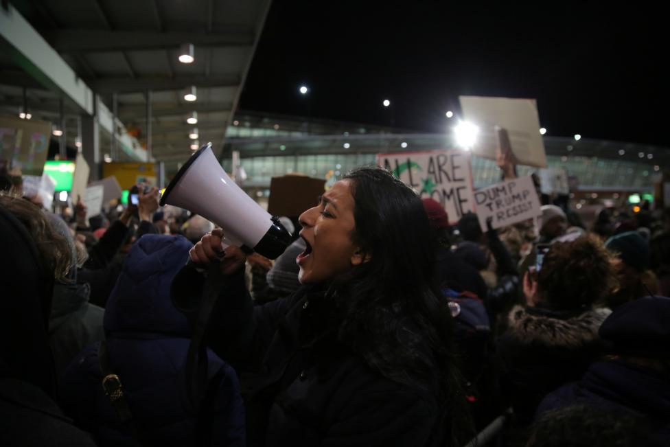 Protesters gather outside Terminal 4 at JFK airport in opposition to U.S. president Donald Trump's proposed ban on immigration in Queens, New York City. REUTERS/Stephen Yang