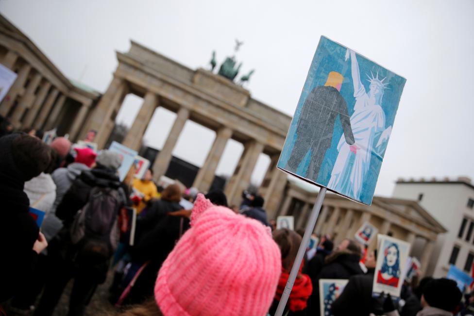 People gather in front of the U.S. Embassy on Pariser Platz beside Brandenburg Gate in solidarity with women's march in Washington and many other marches in several countries, in Berlin, Germany, January 21, 2017. REUTERS/Hannibal Hanschke