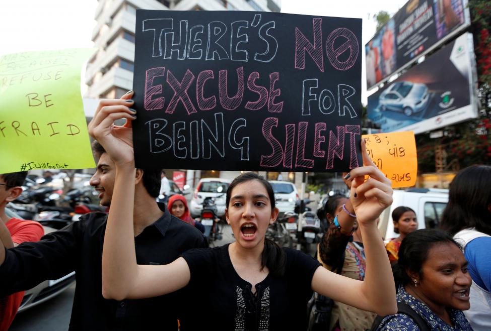 A woman shouts slogans as she takes part in the #IWillGoOut rally, to show solidarity with the Women's March in Washington, along a street in Ahmedabad, India. REUTERS/Amit Dave