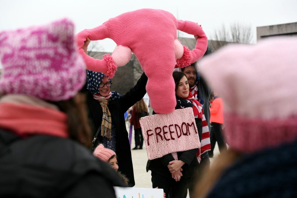 People display a knitted replica of the female reproductive system at the Women's March. REUTERS/Canice Leung