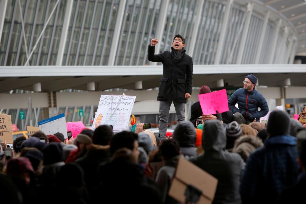 New York City Council Member Carlos Menchaca addresses a crowd during an anti-Donald Trump immigration ban protest outside Terminal 4 at John F. Kennedy International Airport. REUTERS/Andrew Kelly