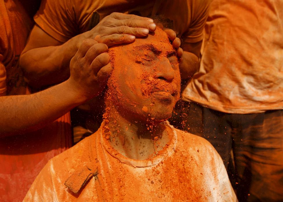 NEPAL: A devotee is smeared with a vermillion powder while celebrating the 