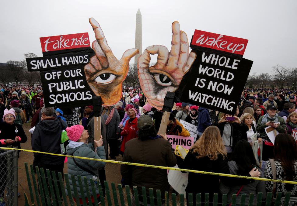 Banners are held aloft during WomenÂs March on Washington. REUTERS/Joshua Roberts