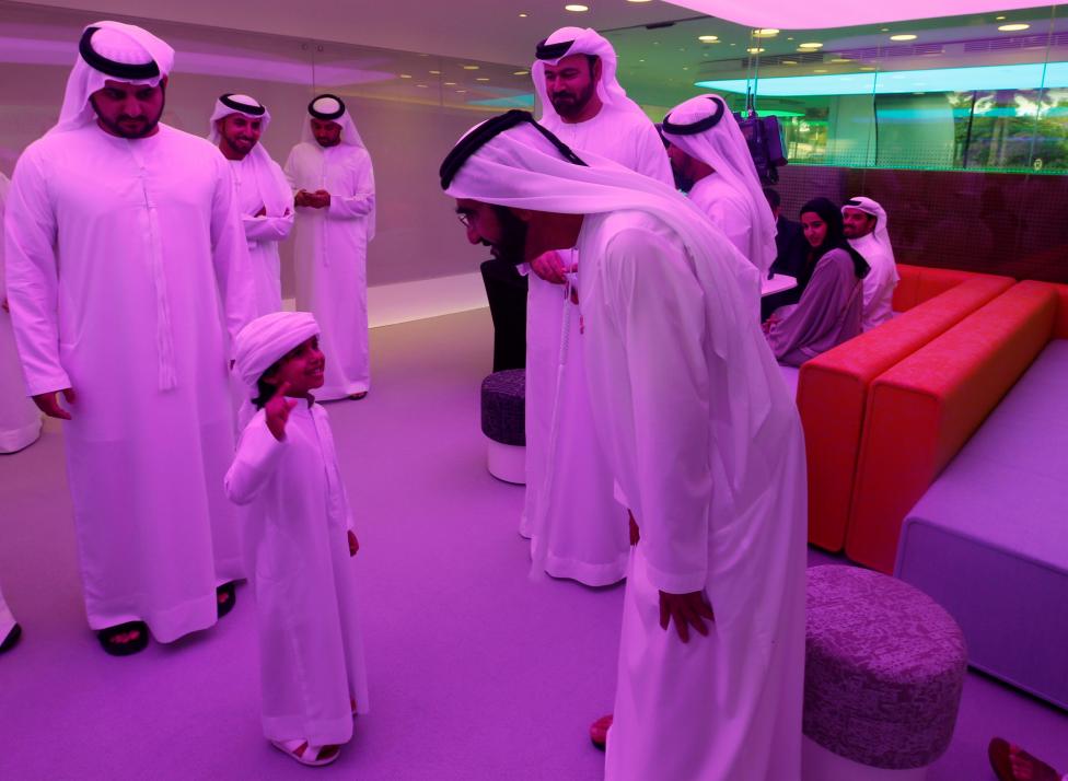 UNITED ARAB EMIRATES: Sheikh Mohammed bin Rashid Al Maktoum, Vice-President and Prime Minister of the UAE and Ruler of Dubai, talks with a child during the official opening ceremony of the world's first functional 3D printed offices in Dubai May 23, 2016. REUTERS/Ahmed Jadallah