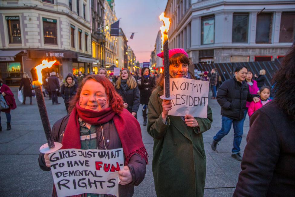 Protesters walks with torchlight in the Women's March in Oslo, Norway. NTB Scanpix/Stian Lysberg Solum via REUTERS