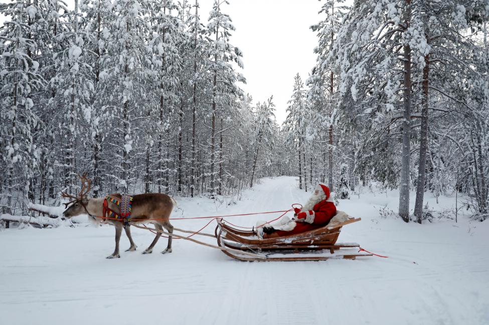 FINLAND: Santa Claus rides in his sleigh as he prepares for Christmas in the Arctic Circle near Rovaniemi, Finland December 15, 2016. REUTERS/Pawel Kopczynski