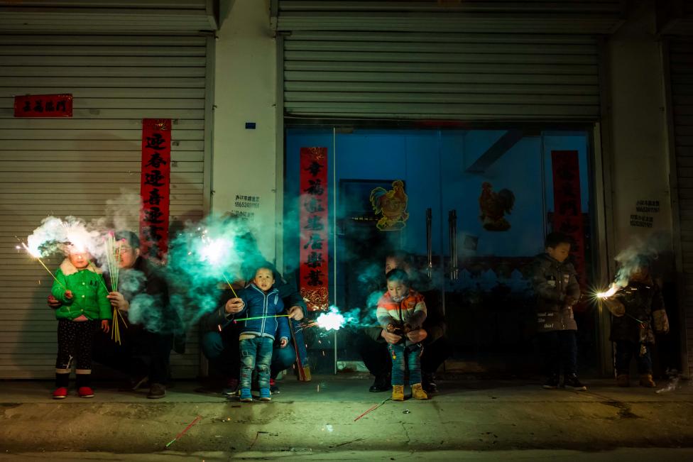 Children play with fire crackers on the eve of the Chinese Lunar New Year, or the Spring Festival, in Lianyungang, Jiangsu province, China. REUTERS/Stringer