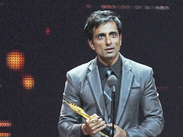 Indian actor Sonu Sood reacts receiving Best Performance in Negetive Role award during 2011 International Indian Film Academy (IIFA) awards at the Roger Centres in Toronto, Ontario, on June 25, 2011. PHOTO : AFP
