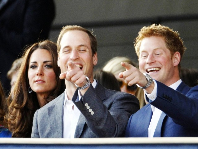 Princes William (C) and Harry (R) laugh as they sit with Catherine, Duchess of Cambridge during the Diamond Jubilee concert at Buckingham Palace in London June 4, 2012. PHOTO: REUTERS