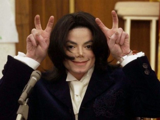 Michael Jackson gestures during a break in testimony in his breach of contract trial in Santa Maria, Calif, December 3, 2002. The singer's total lifetime earnings from music were estimated at $500 million. PHOTO: REUTERS 