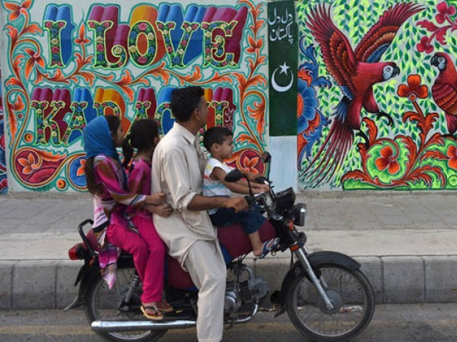 Karachi artists reclaim city walls  from hate graffiti 