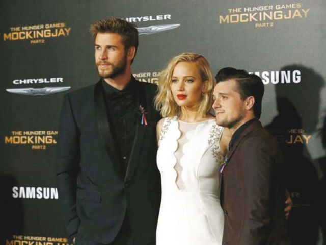 Cast members Liam Hemsworth (L), Jennifer Lawrence (C) and Josh Hutcherson (R) pose at the premiere of The Hunger Games: Mockingjay - Part 2 in Los Angeles. PHOTO: REUTERS 