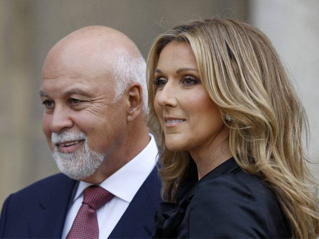 Celine Dion poses with husband Rene Angelil after she was awarded with France's Legion d'Honneur by French President Nicolas Sarkozy during a ceremony at the Elysee Palace in Paris in this May 22, 2008. REUTERS/Charles Platiau