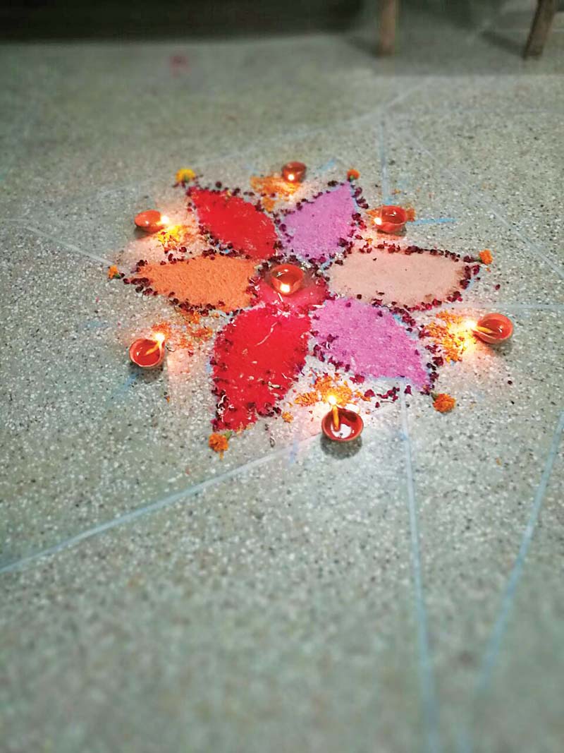 a rangoli with lit oil lamps at a house in rawalpindi to celebrate diwali photo express