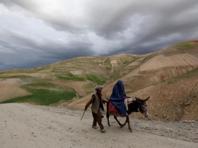 An Afghan family travels with a donkey in the Argo district in Badakhshan province. PHOTO: REUTERS