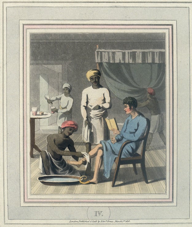 “An Indian servant washes the feet of his European master.”