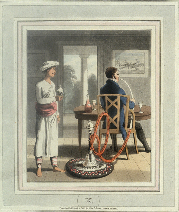 “An Indian servant watches his European master smoking a hookah.”