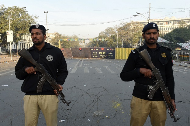 Police stand guard at the site of a suicide bombing in Lahore on February 14, 2017. PHOTO: AFP