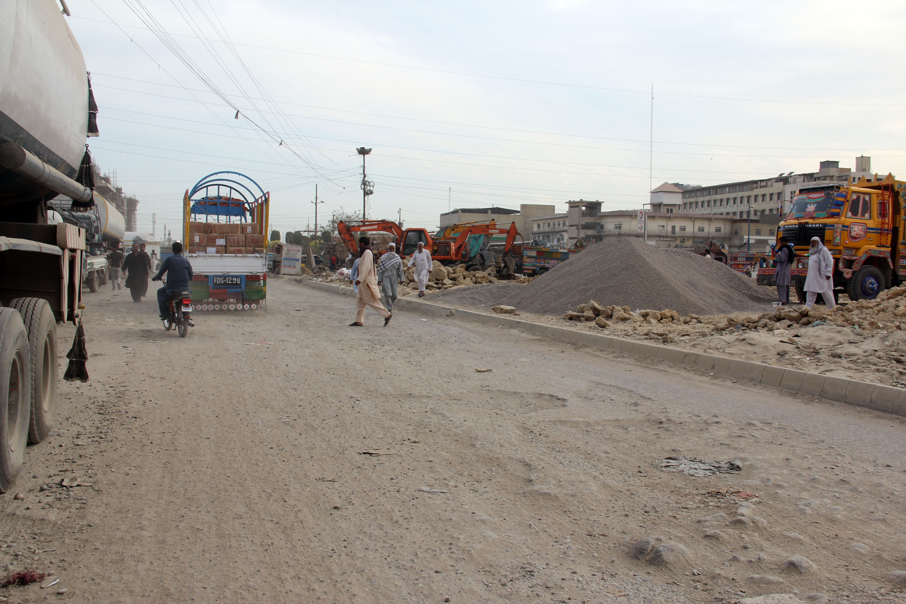 The median between the roads has been encroached by sand and gravel mafia. PHOTO: AYESHA MIR/EXPRESS