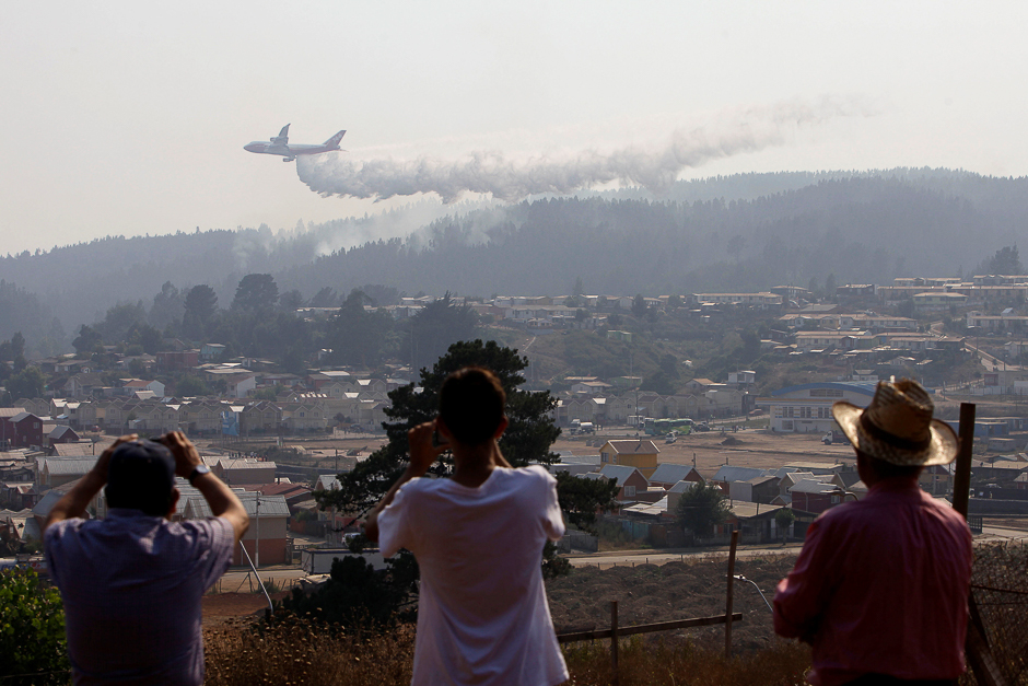 A Boeing 747-400 Super Tanker from the US drops water to extinguish wildfires in Chile's central-south regions, in Dichato, Chile. PHOTO: REUTERS