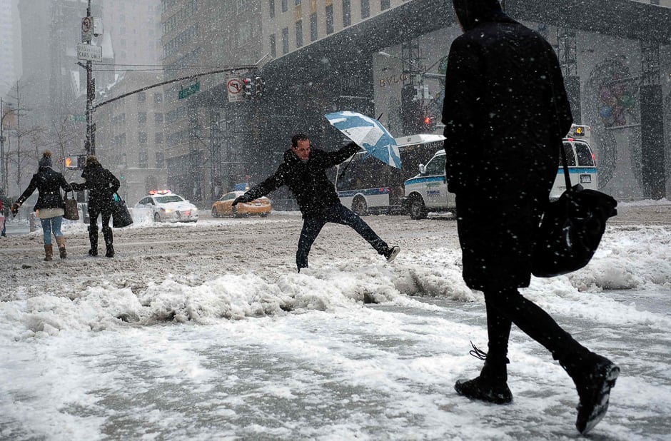 People make their way during a winter storm in New York. PHOTO: AFP