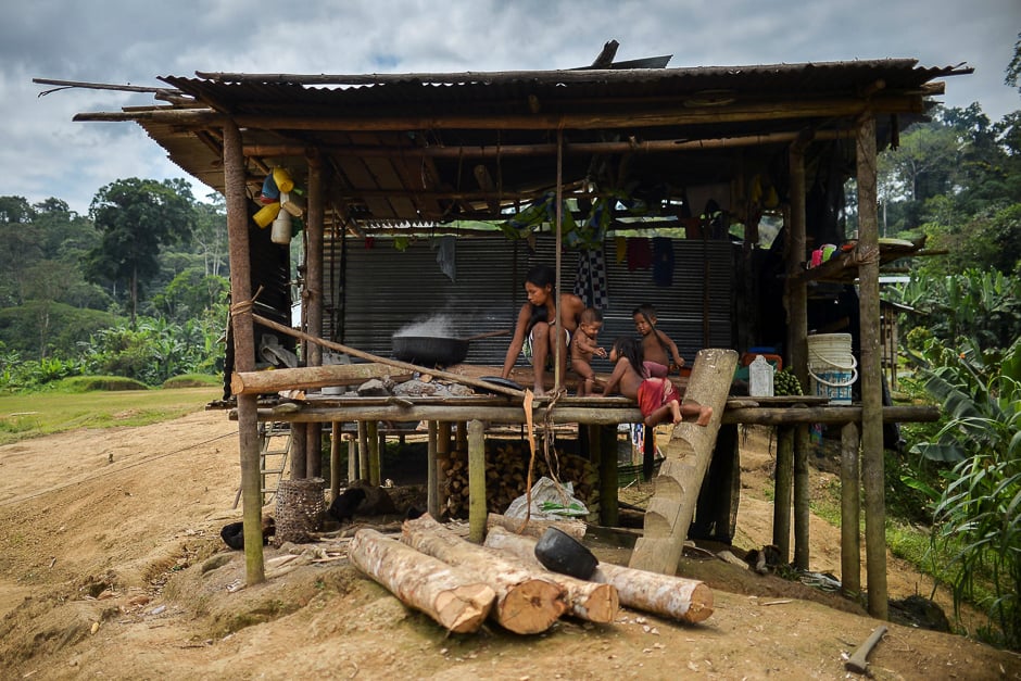 An Embera indigenous woman cooks alongside her children in Tasi, a rural village in Alto Baudo, department of Choco, western Colombia. PHOTO: AFP